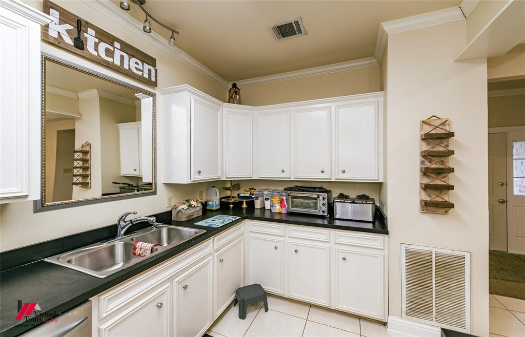 266 Stark Road Stonewall, LA 71078 - Photo 13 of 39 a kitchen with stainless steel appliances granite countertop a sink a stove and cabinets