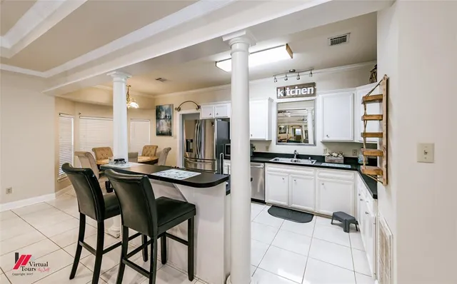a kitchen with a table and chairs in it