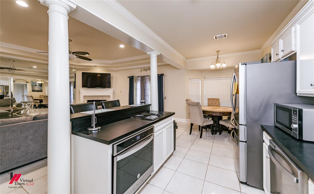 266 Stark Road Stonewall, LA 71078 - Photo 39 of 39 a kitchen with granite countertop a sink cabinets and stainless steel appliances