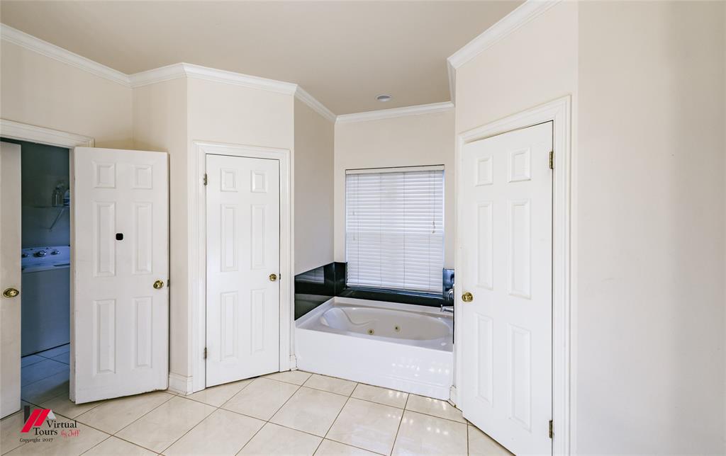 266 Stark Road Stonewall, LA 71078 - Photo 21 of 39 a bathroom with a bathtub and shower