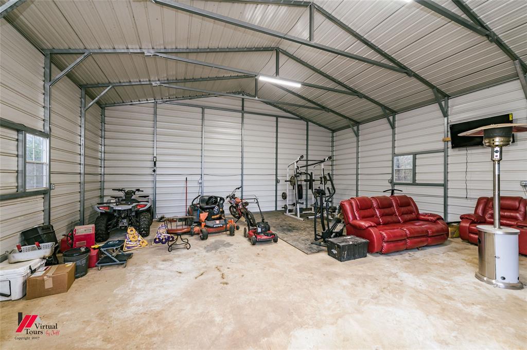 266 Stark Road Stonewall, LA 71078 - Photo 23 of 39 a view of car parked in garage