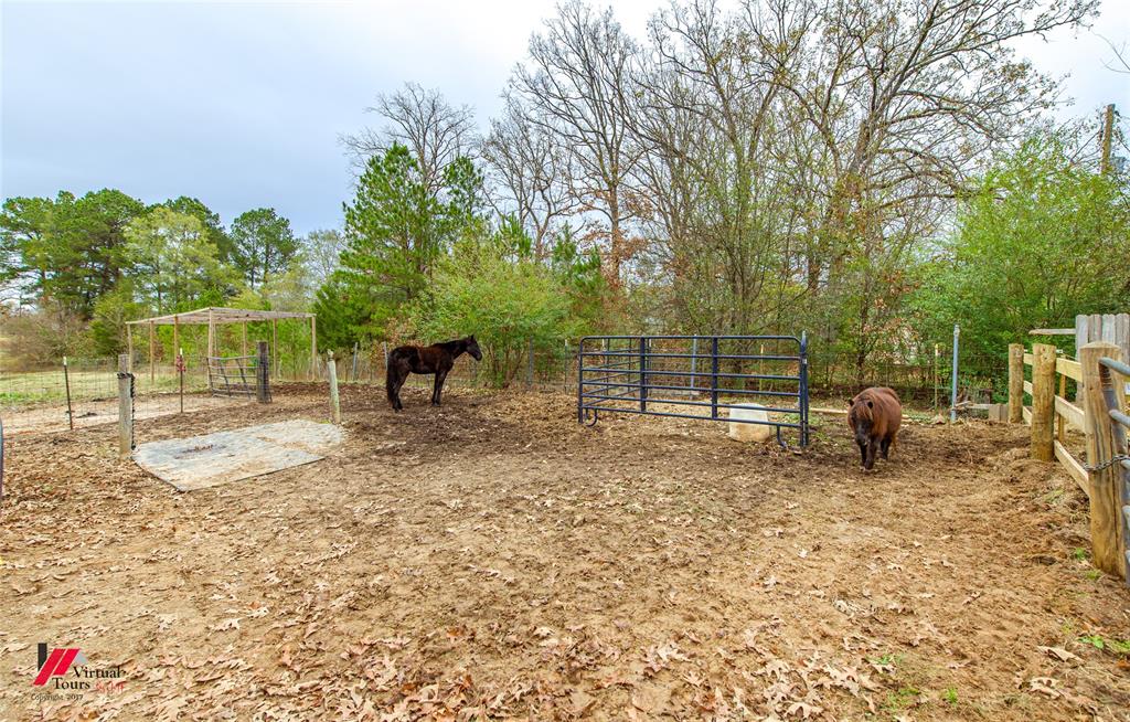 266 Stark Road Stonewall, LA 71078 - Photo 34 of 39 a view of a bench in a backyard