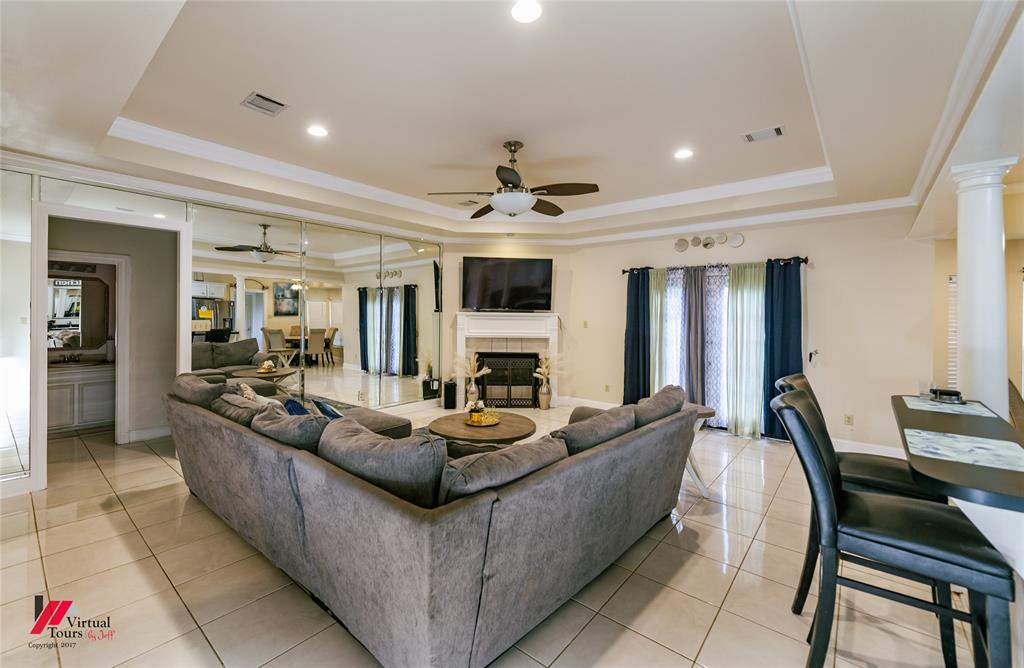 266 Stark Road Stonewall, LA 71078 - Photo 8 of 39 a living room with fireplace furniture and a flat screen tv
