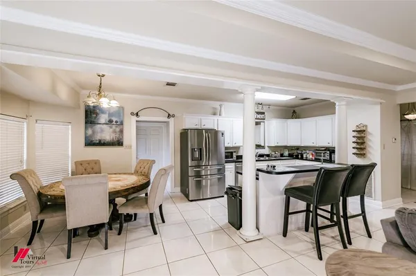 a view of a dining room kitchen and a window