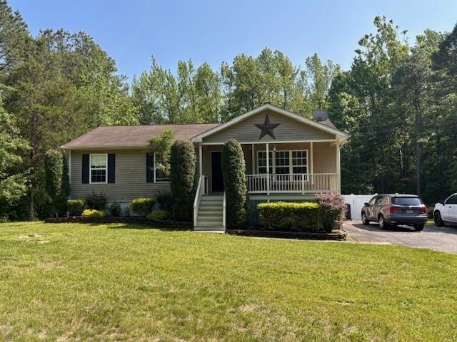 120 Head Of River Road Corbin City, NJ 08270 - Photo 14 of 20 a front view of a house with a yard
