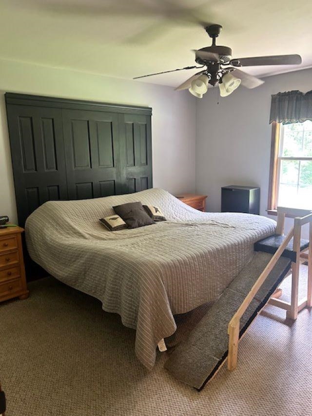 120 Head Of River Road Corbin City, NJ 08270 - Photo 3 of 20 a bedroom with a bed and a chandelier