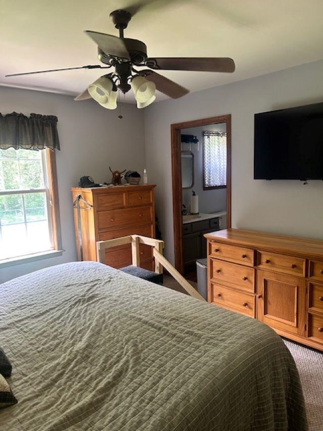 120 Head Of River Road Corbin City, NJ 08270 - Photo 4 of 20 a bedroom with a bed and a flat screen tv