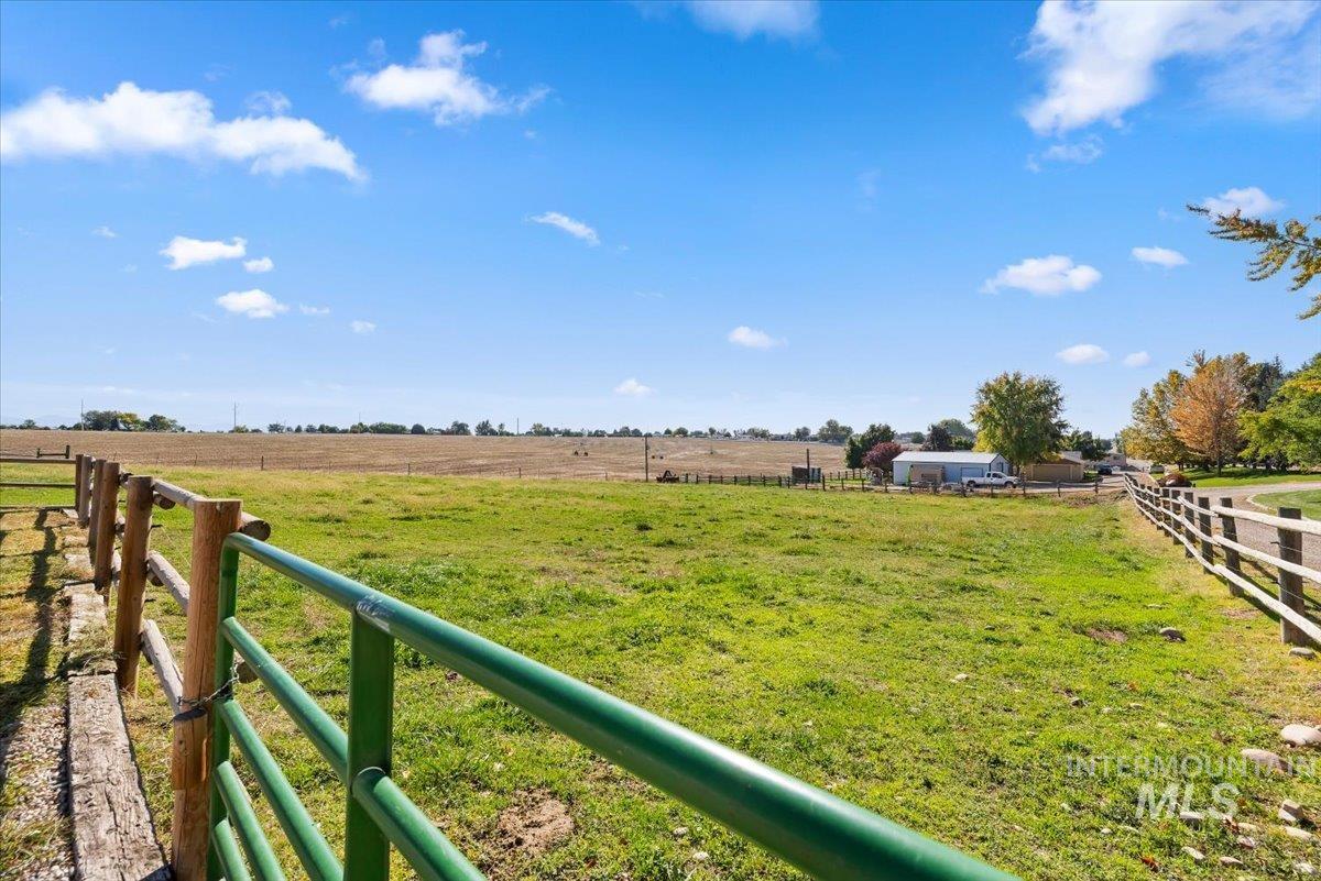 24240 Tiger Lane Caldwell, ID 83607 - Photo 48 of 50 Underground sprinklers, fenced + hot wire around about 2 acres of green pasture bordered by a rustic wood rail fence and a metal gate