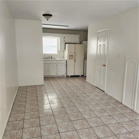 a view of a kitchen with a sink and a stove