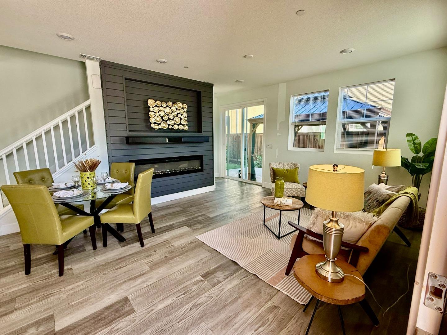 2049 Daimler Street Lathrop, CA 95330 - Photo 1 of 1 a living room with furniture a rug and a flat screen tv
