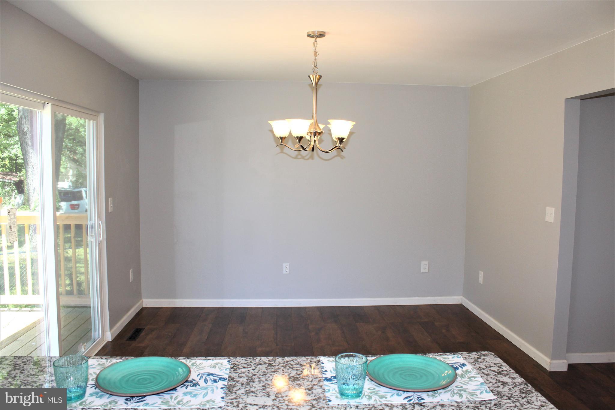 1106 Wampler Road Middle River, MD 21220 - Photo 11 of 27 a view of a room with wooden floor and carpet