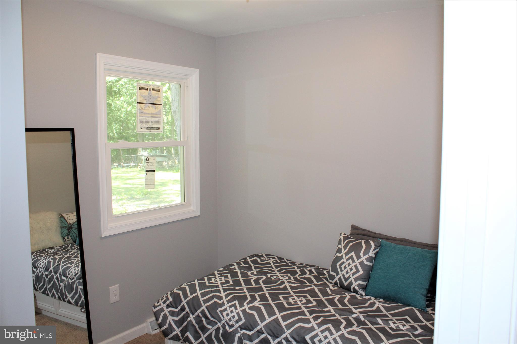 1106 Wampler Road Middle River, MD 21220 - Photo 14 of 27 a bedroom with a bed and a window