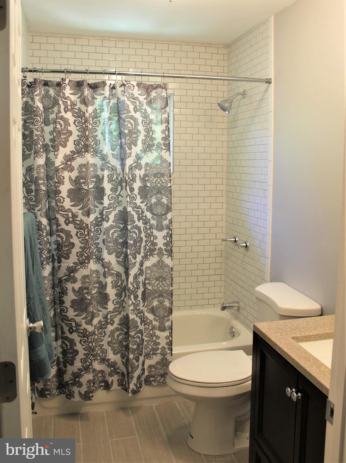 1106 Wampler Road Middle River, MD 21220 - Photo 16 of 27 a bathroom with a toilet and shower