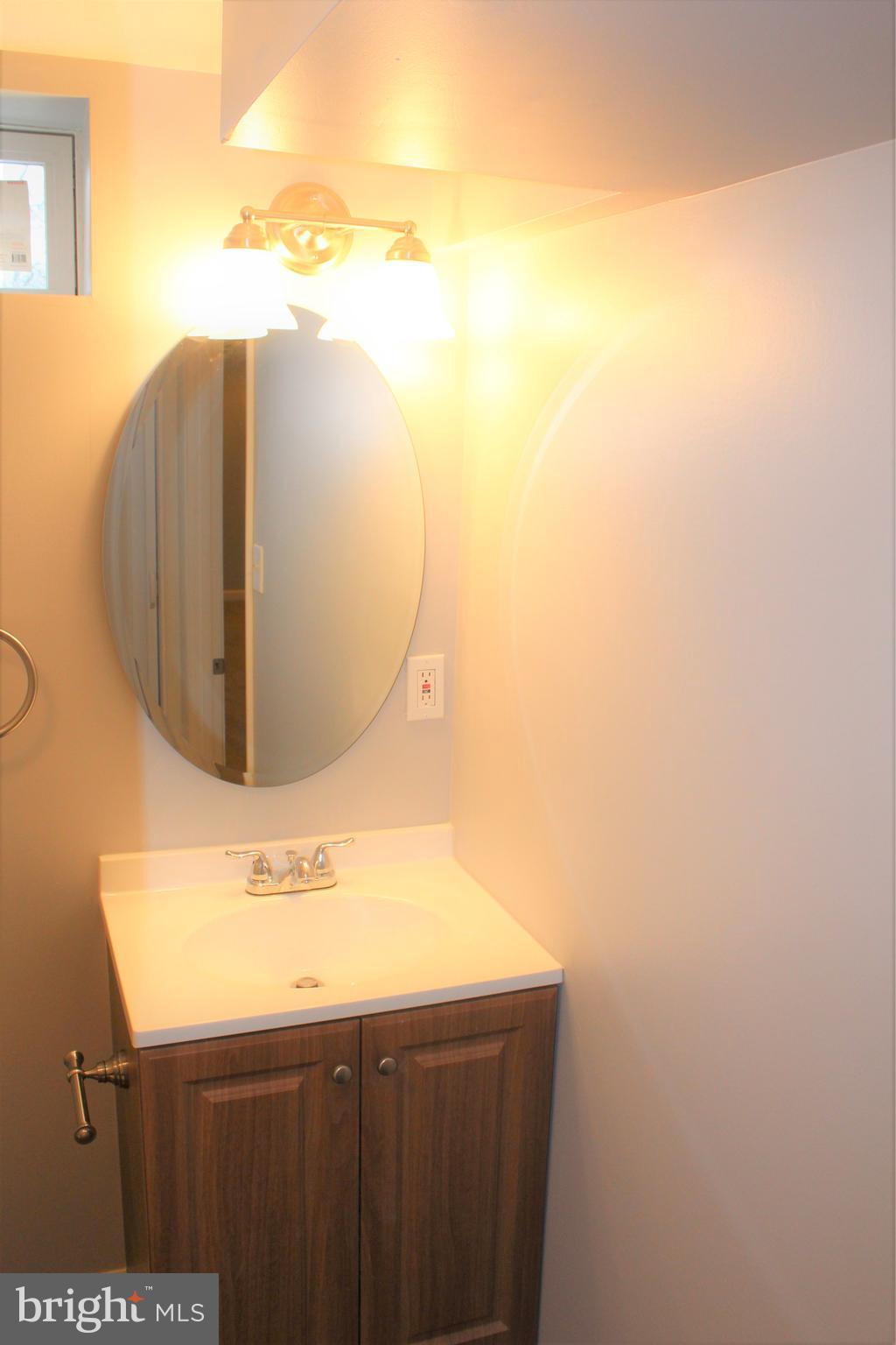 1106 Wampler Road Middle River, MD 21220 - Photo 24 of 27 a bathroom with a sink and mirror