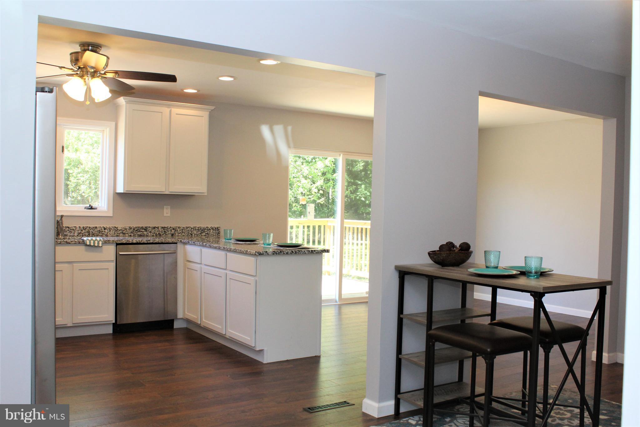 1106 Wampler Road Middle River, MD 21220 - Photo 7 of 27 a kitchen that has a table and chairs in it