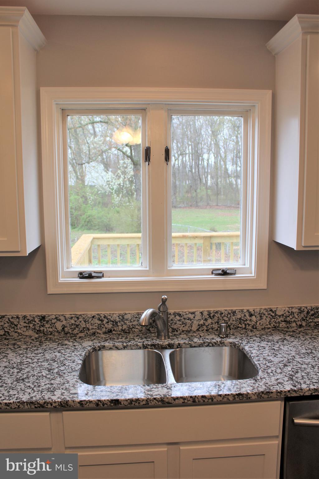 1106 Wampler Road Middle River, MD 21220 - Photo 9 of 27 a kitchen with granite countertop a sink and a window