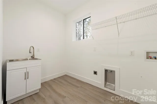 a bathroom with a sink and vanity