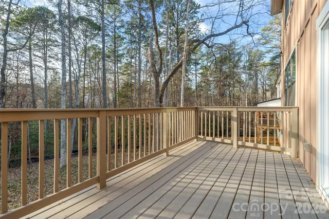 a view of a wooden roof with wooden floor and fence