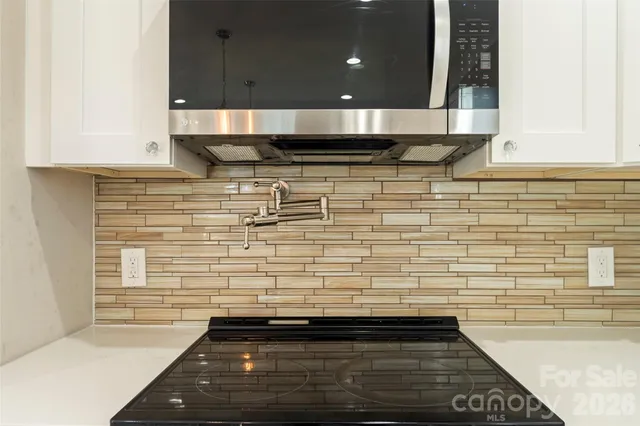 a view of an empty room and wooden floor