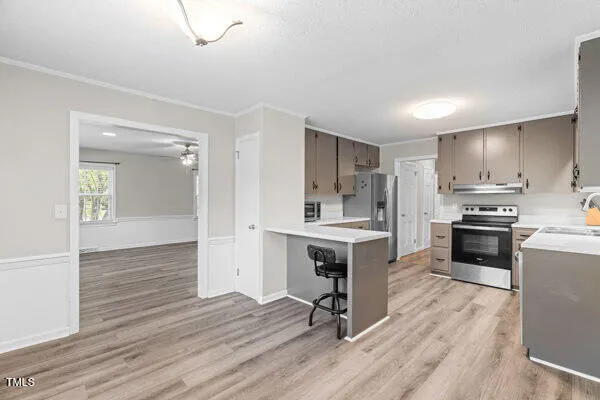 a kitchen with a sink stove and refrigerator