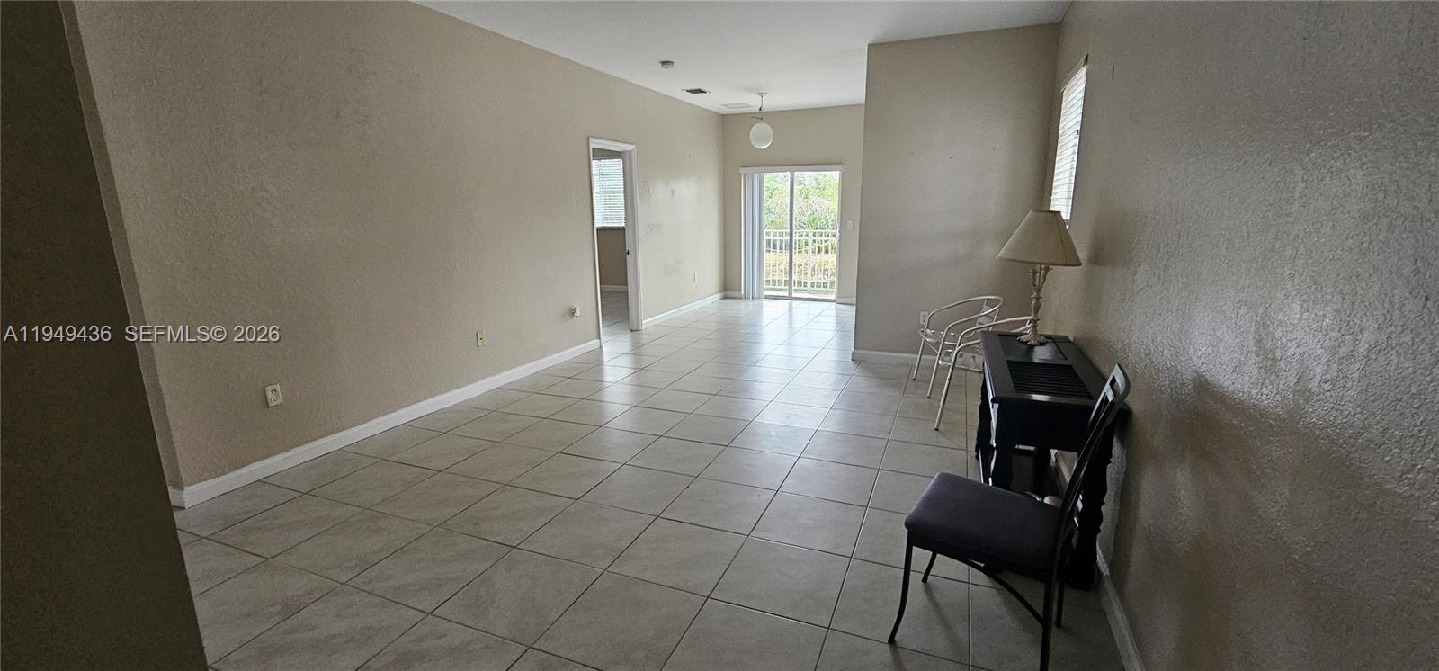 2711 Northeast 4th Street, Unit 204 Homestead, FL 33033 - Photo 3 of 13 a bathroom with a glass door shower