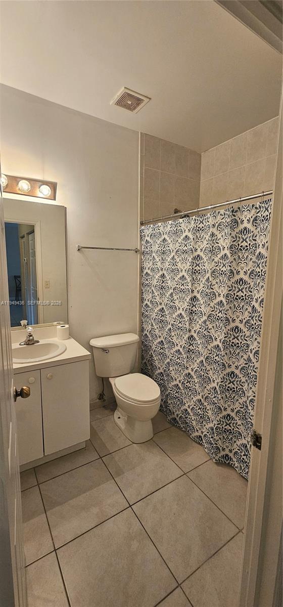 2711 Northeast 4th Street, Unit 204 Homestead, FL 33033 - Photo 10 of 13 a bathroom with a sink toilet and shower