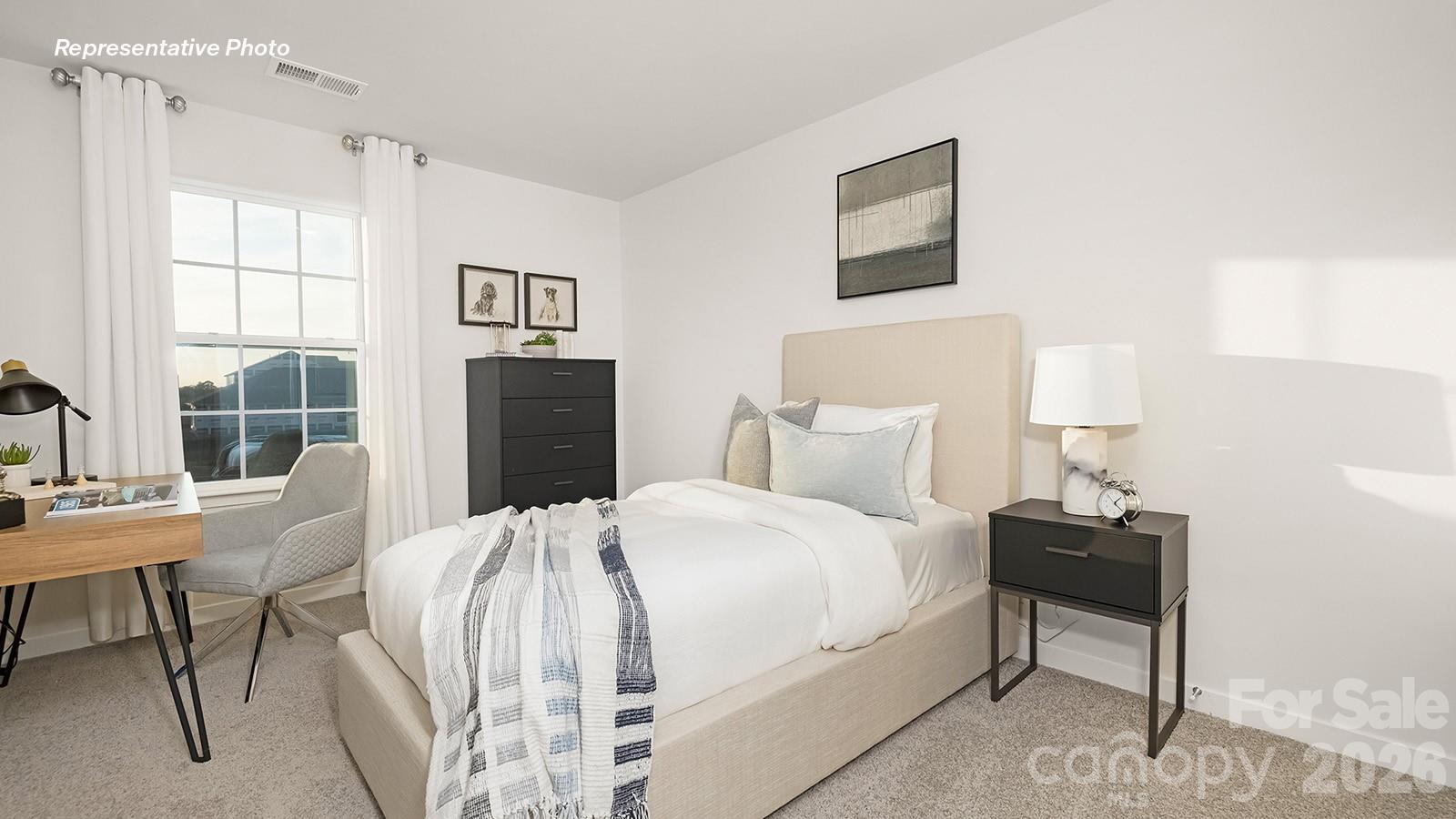 566 North Sparkleberry Street Chester, SC 29706 - Photo 19 of 28 a bedroom with a bed and a table