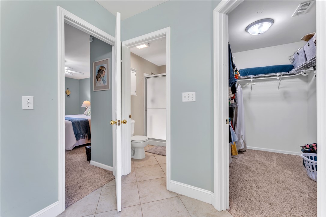 154 Hammond School Road Anderson, SC 29621 - Photo 15 of 33 This interior hallway connects to a comfortable bedroom, a functional bathroom, and a spacious walk-in closet.
