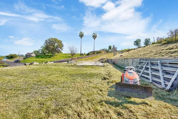 a view of a swimming pool with a yard
