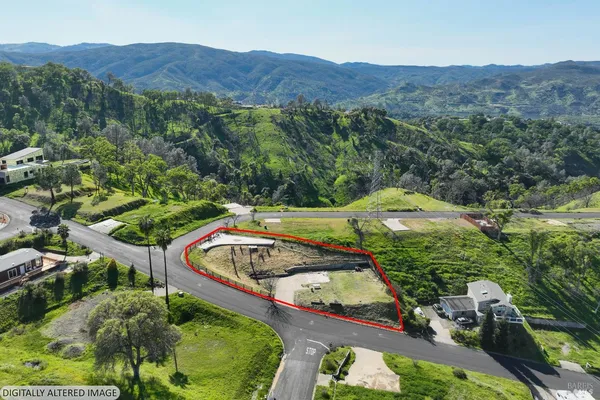 an aerial view of a house with a garden