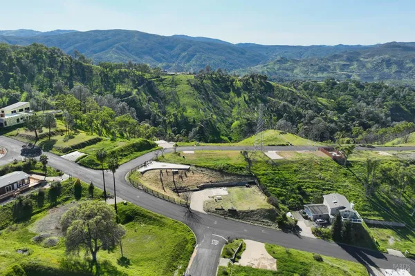 an aerial view of a house with mountain view