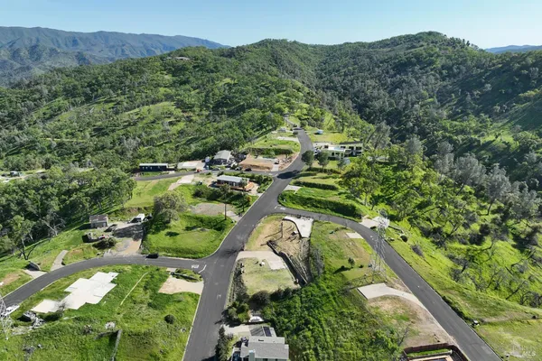 an aerial view of residential houses and outdoor space