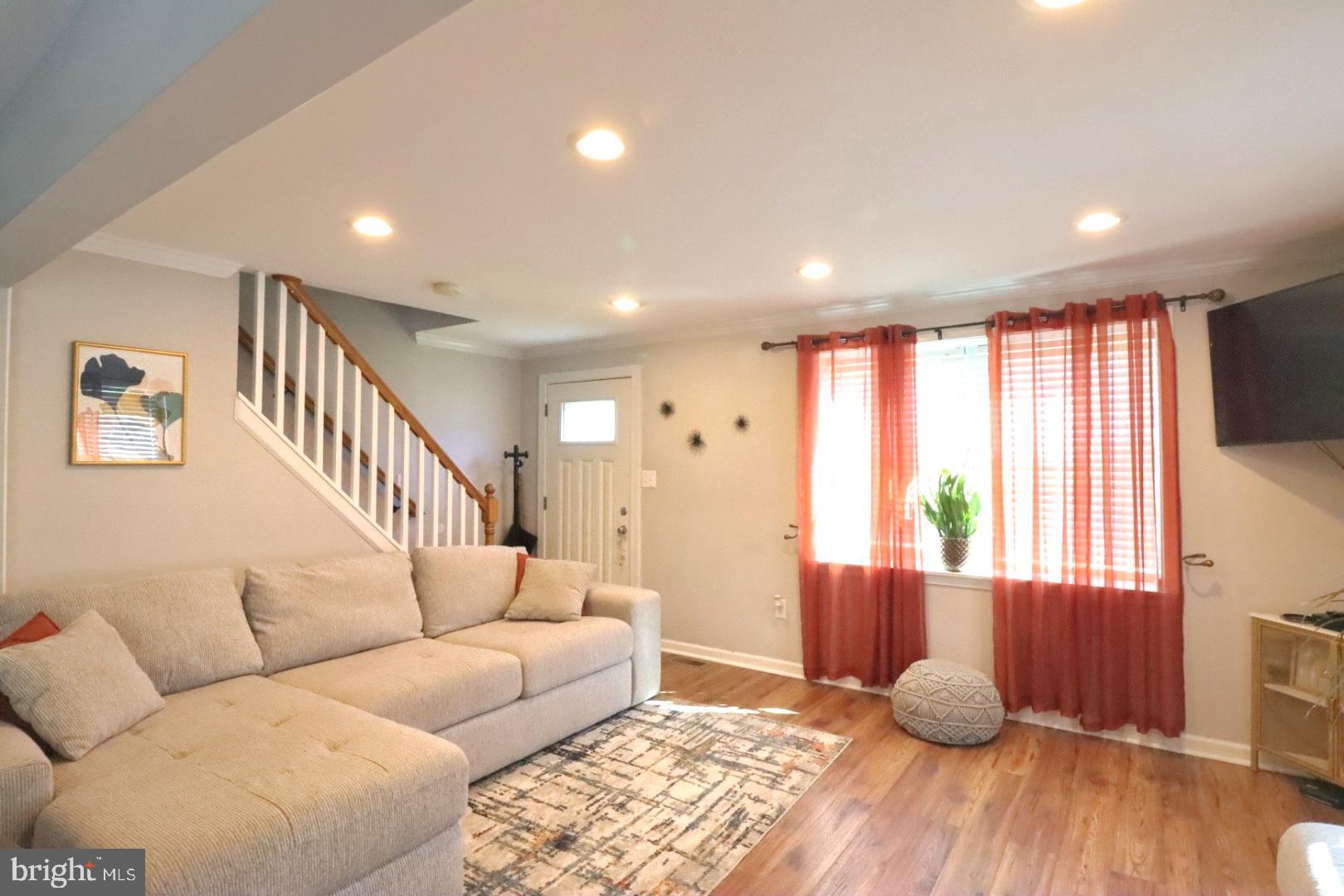 718 Cliffedge Road Pikesville, MD 21208 - Photo 7 of 28 a living room with furniture and a window