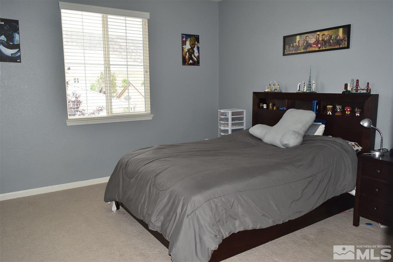 10675 Cedar Bend Court Reno, NV 89521 - Photo 14 of 22 a bedroom with a bed and window