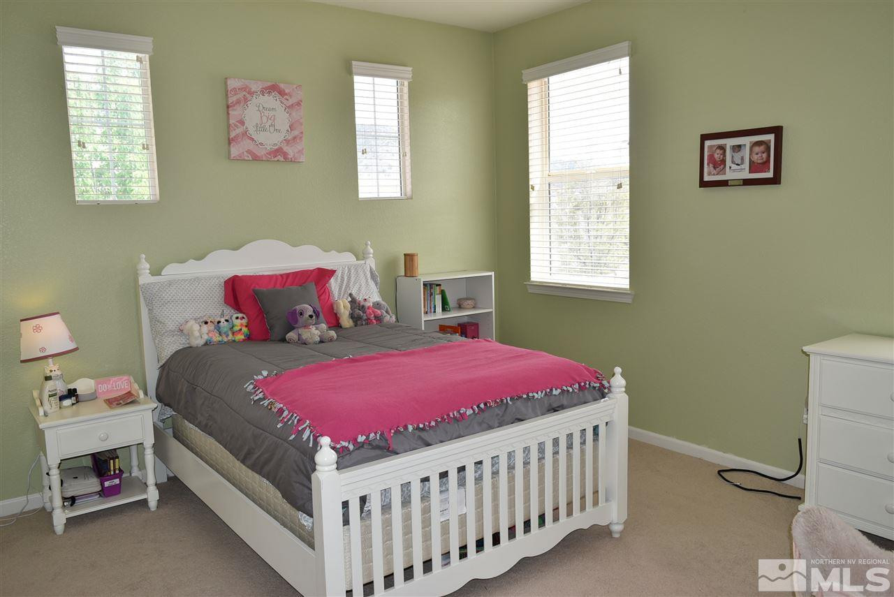 10675 Cedar Bend Court Reno, NV 89521 - Photo 15 of 22 a bedroom with a bed and a window