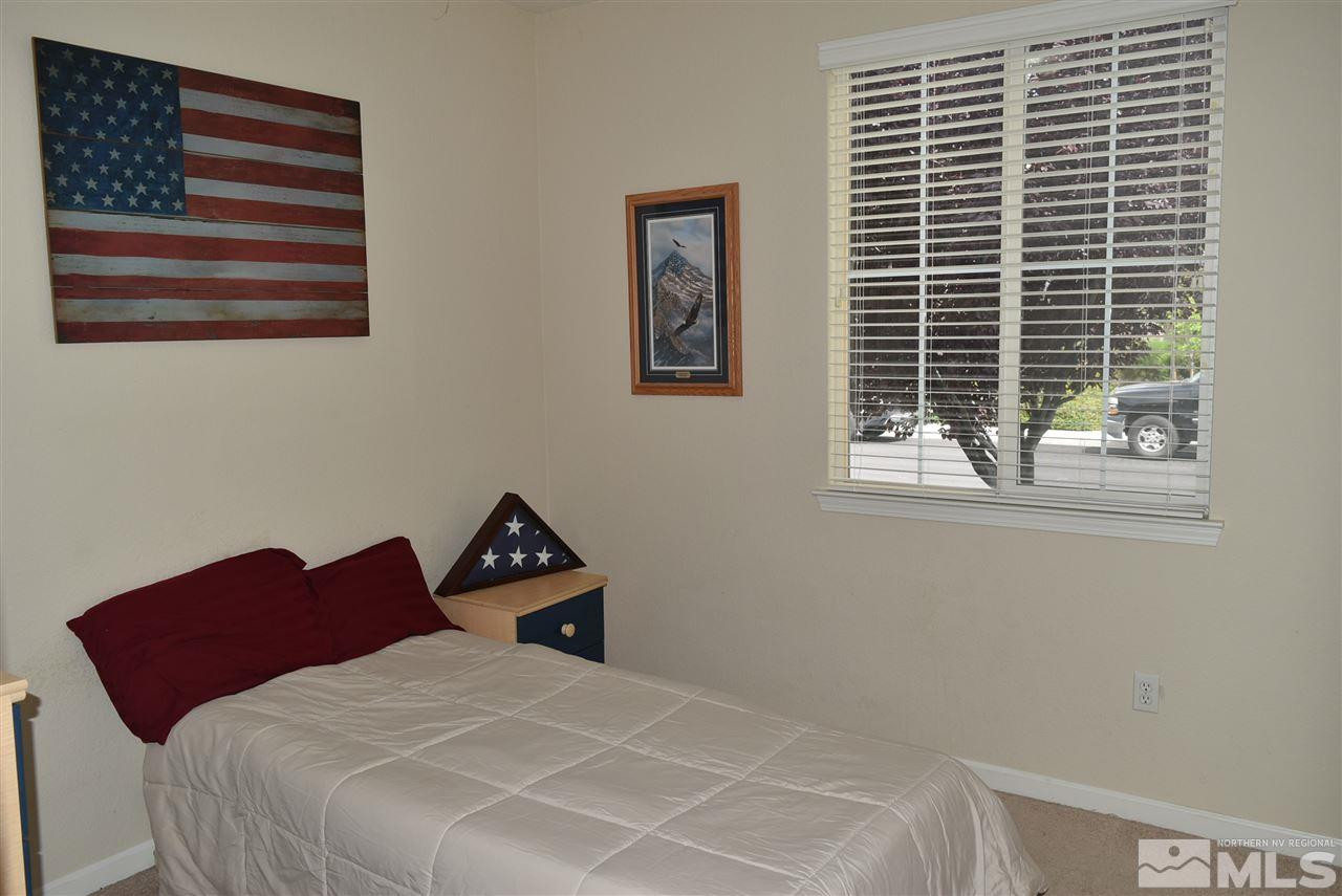 10675 Cedar Bend Court Reno, NV 89521 - Photo 19 of 22 a bedroom with a bed and a window