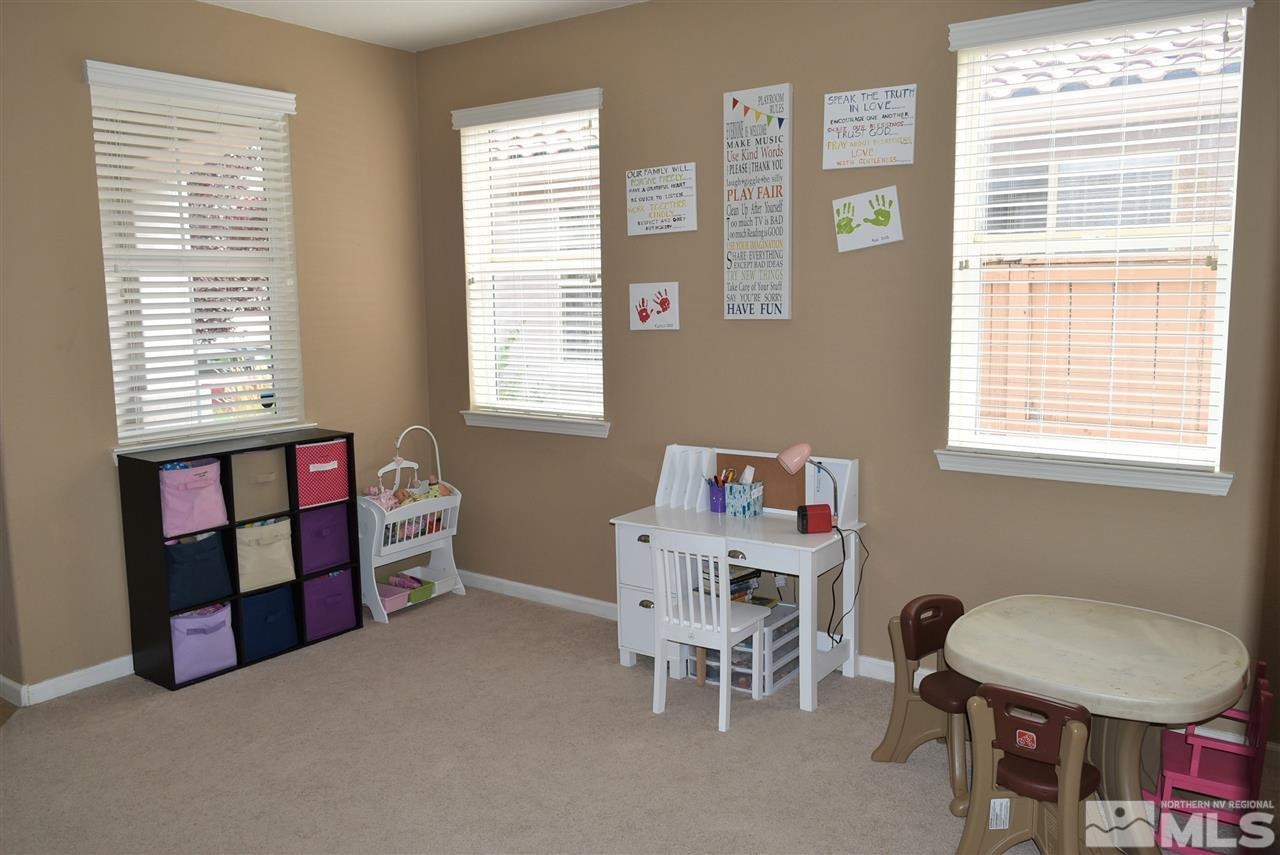 10675 Cedar Bend Court Reno, NV 89521 - Photo 20 of 22 a room with furniture and a window