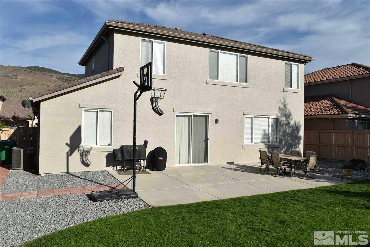 10675 Cedar Bend Court Reno, NV 89521 - Photo 2 of 22 a view of backyard with wheel chair and potted plants