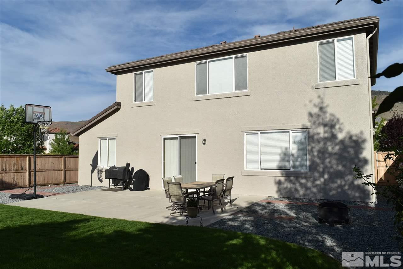 10675 Cedar Bend Court Reno, NV 89521 - Photo 21 of 22 a view of a patio with table and chairs and potted plants