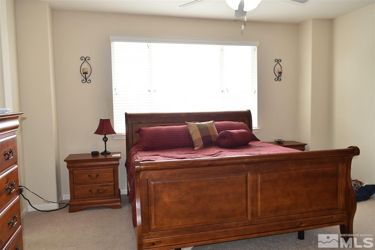 10675 Cedar Bend Court Reno, NV 89521 - Photo 10 of 22 a bed room with a bed and a window