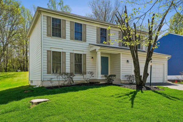 front view of a house with a yard