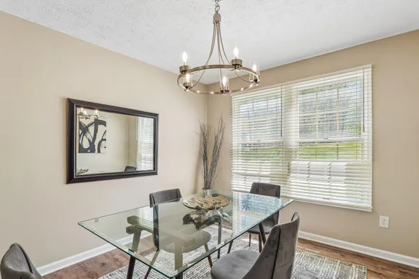 a view of a dining room with furniture window and outside view