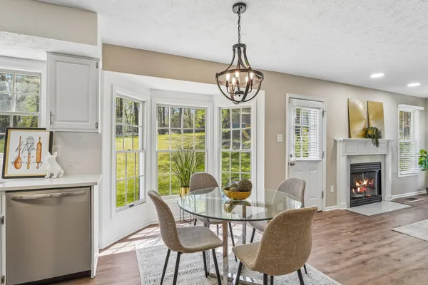 a view of a dining room with furniture window and wooden floor