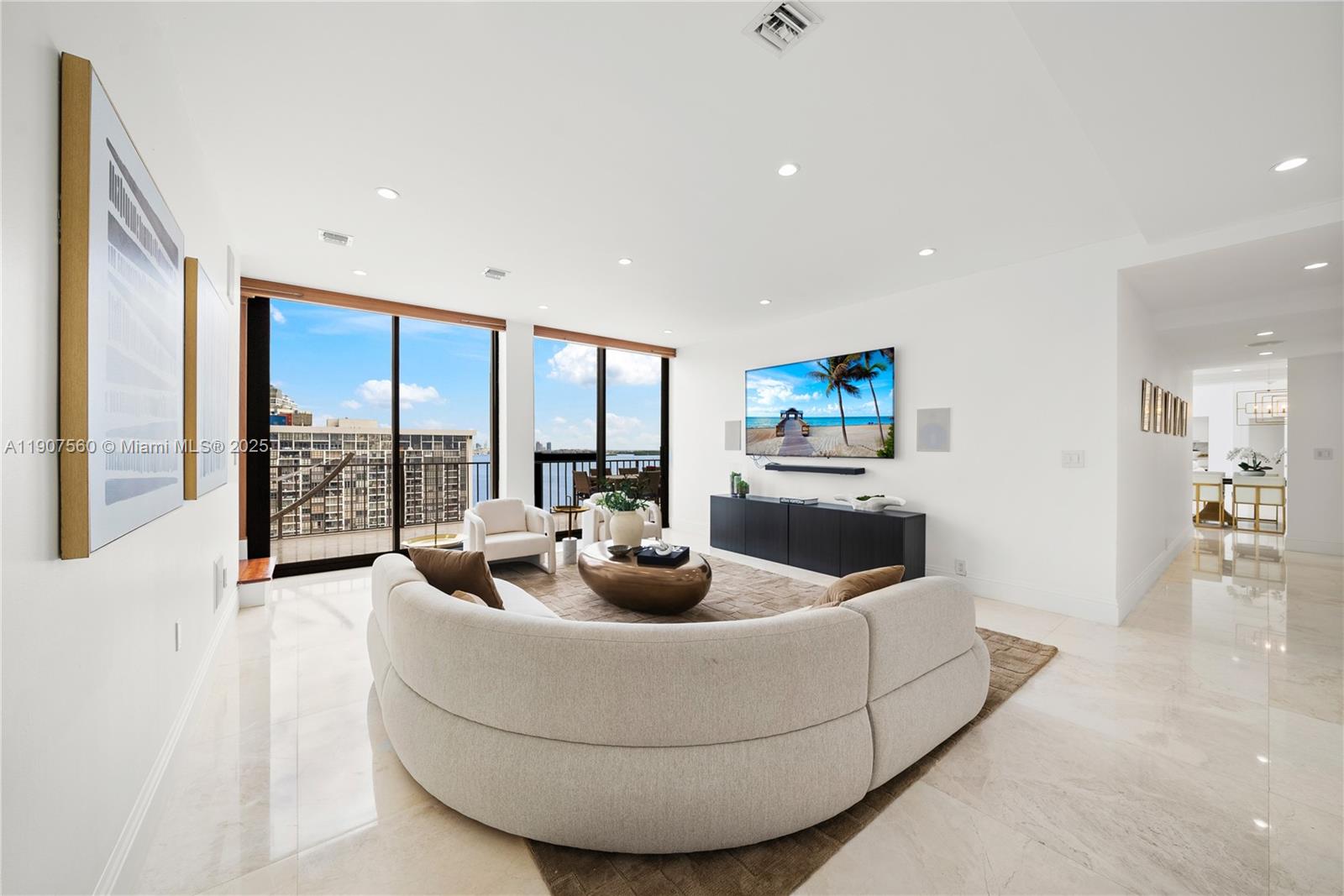 1925 Brickell Avenue, Unit DPH3 Miami, FL 33129 - Photo 19 of 56 a living room with furniture and a large window