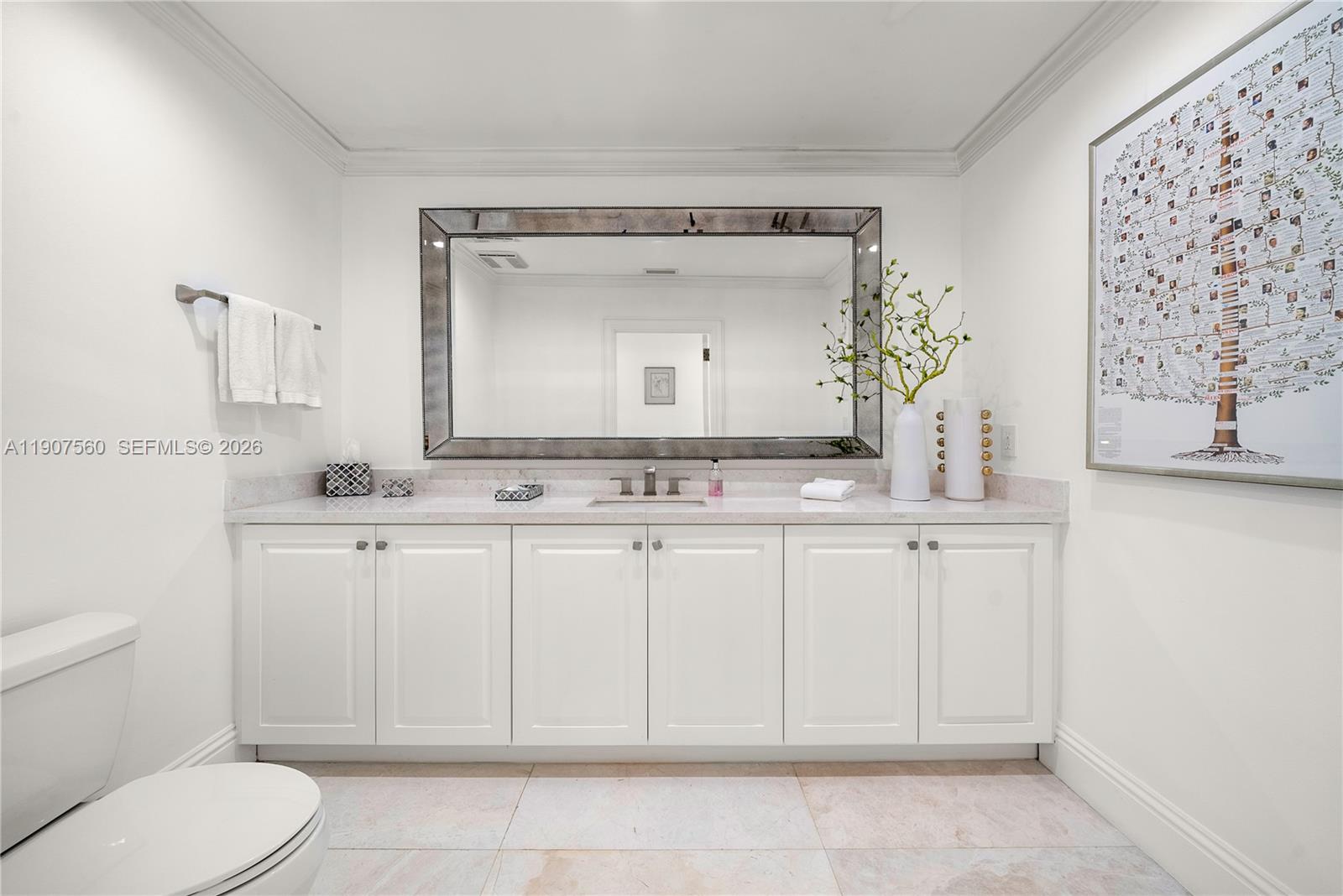 1925 Brickell Avenue, Unit DPH3 Miami, FL 33129 - Photo 23 of 56 a bathroom with a toilet sink and mirror