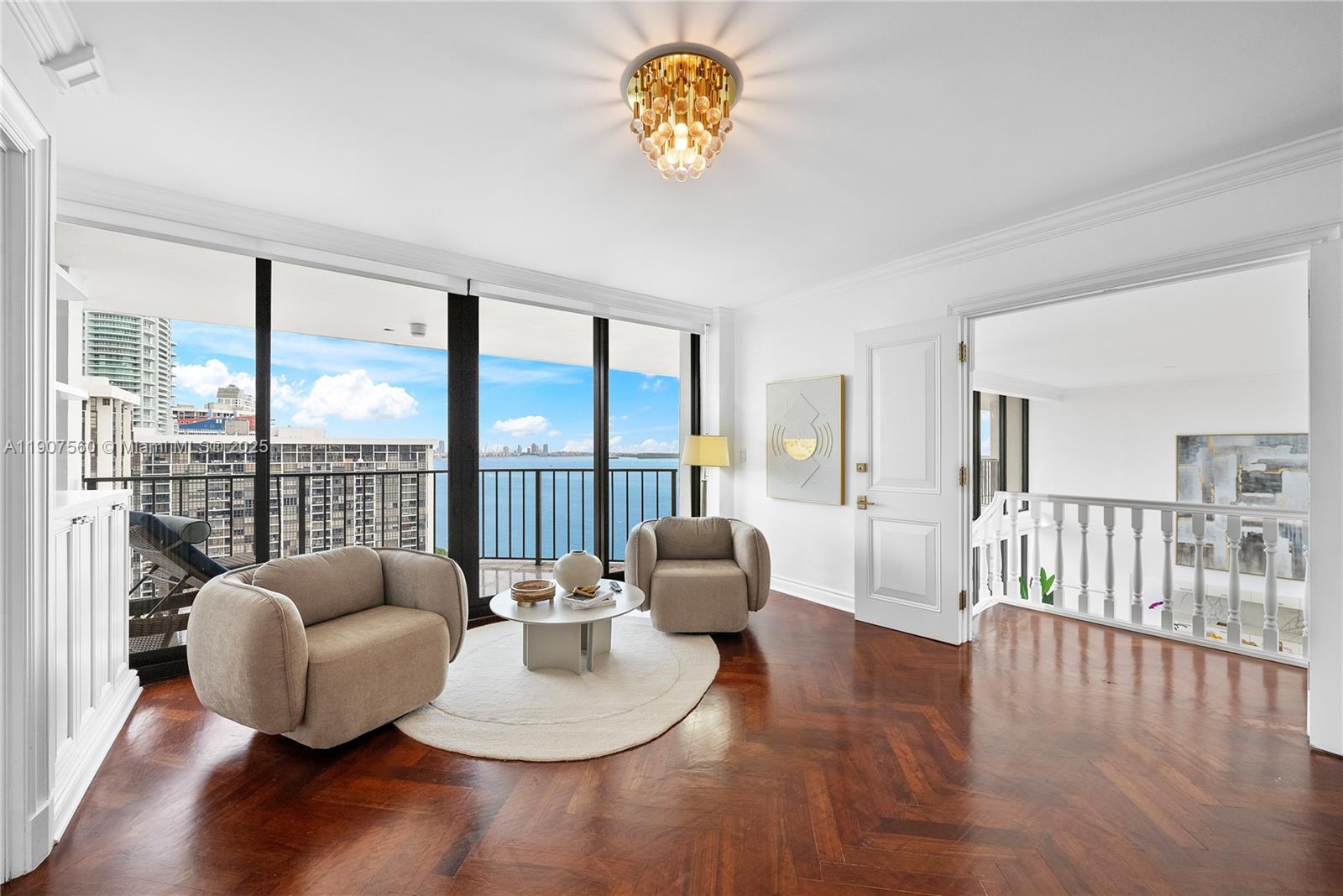 1925 Brickell Avenue, Unit DPH3 Miami, FL 33129 - Photo 25 of 56 a living room with furniture and a large window