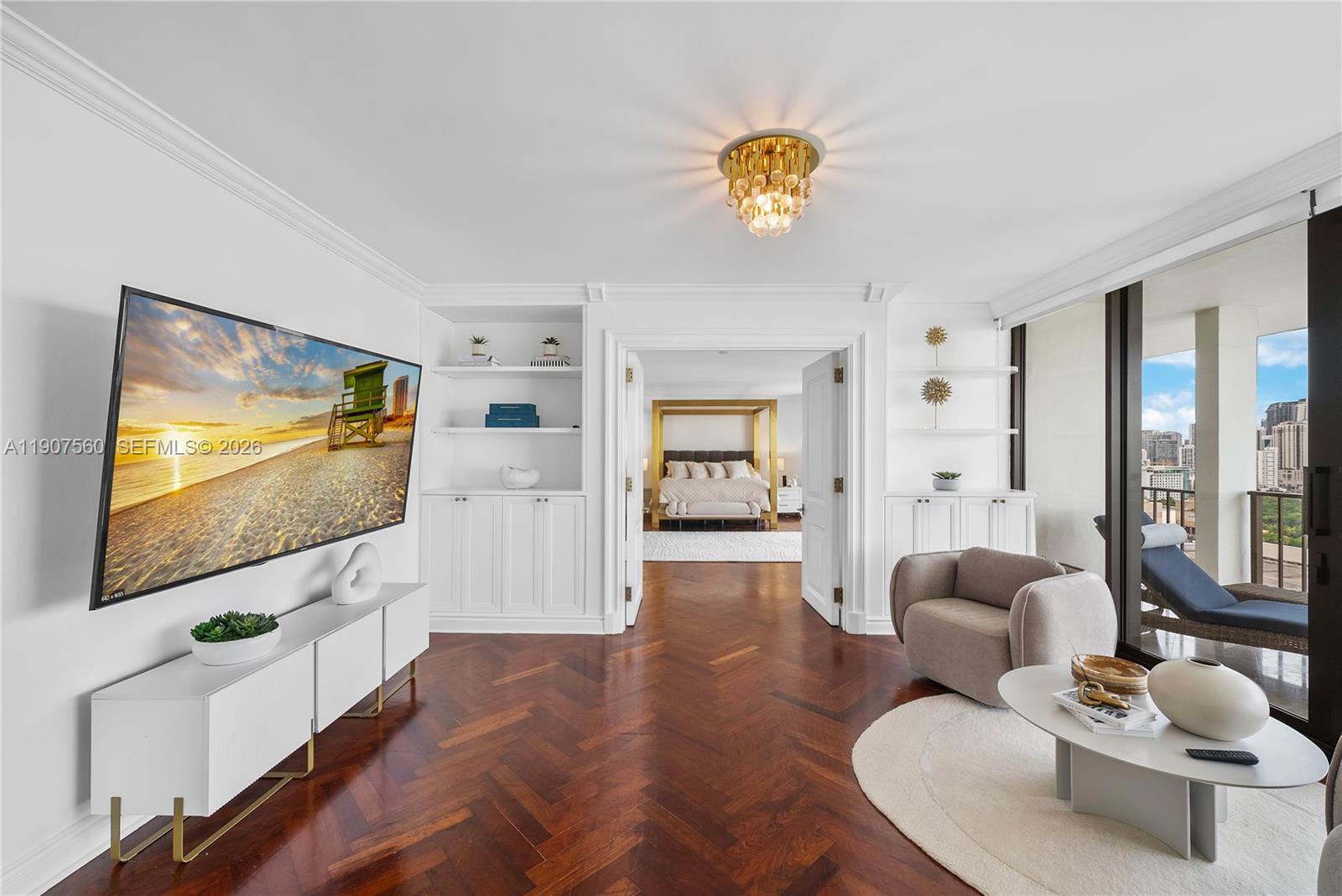 1925 Brickell Avenue, Unit DPH3 Miami, FL 33129 - Photo 25 of 56 a living room with furniture and a flat screen tv