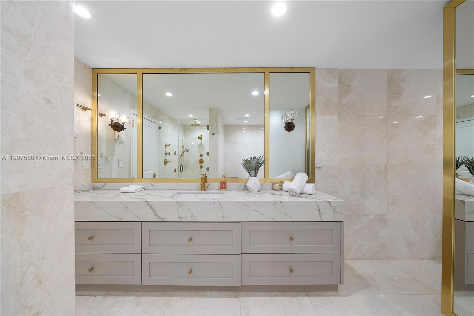 1925 Brickell Avenue, Unit DPH3 Miami, FL 33129 - Photo 32 of 56 a bathroom with a double vanity sink and mirror