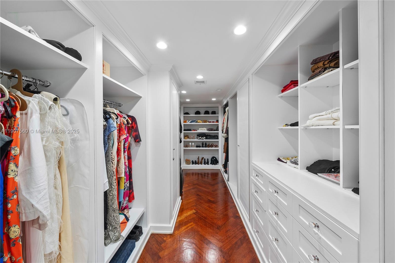 1925 Brickell Avenue, Unit DPH3 Miami, FL 33129 - Photo 35 of 56 a view of walk in closet with clothes and shoes