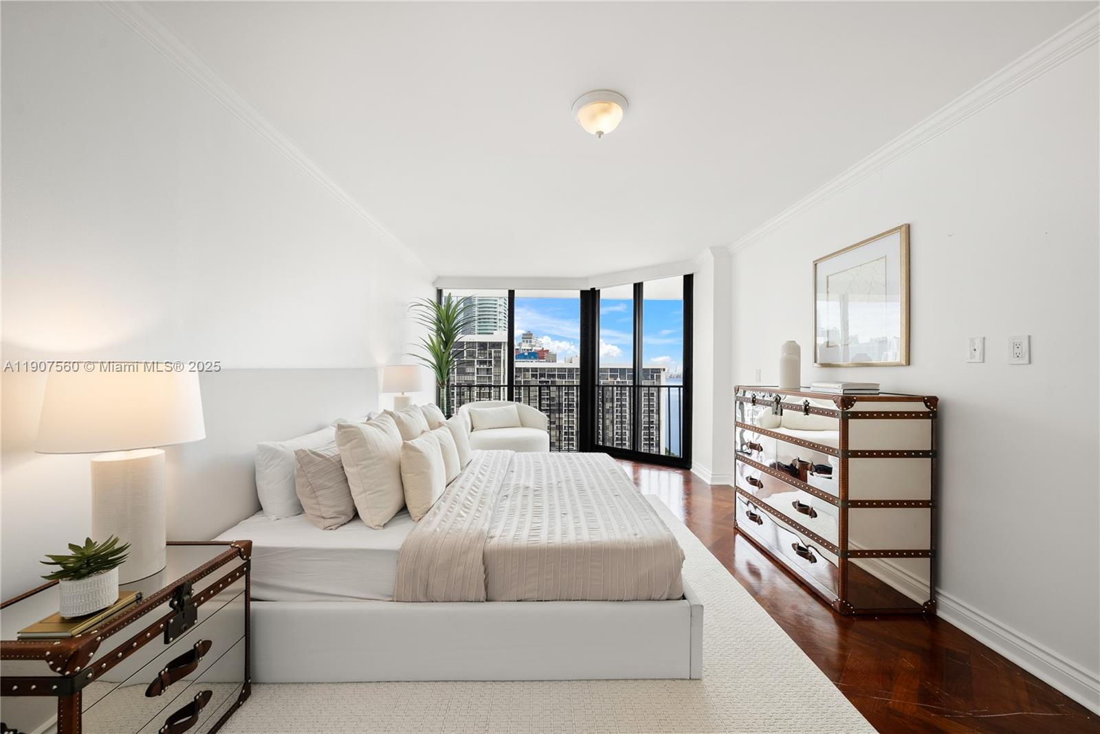 1925 Brickell Avenue, Unit DPH3 Miami, FL 33129 - Photo 40 of 56 a large bedroom with a bed and large window